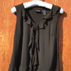 Sassy sleeveless, ruffle front top.